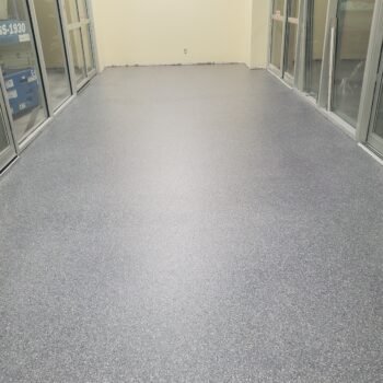 Home Hardware front vestibule store entrance floor completed with a decorative flake MMA finish for fast curing